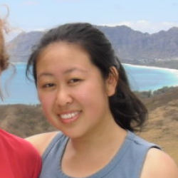 Image of Alice Ren with mountains and ocean in background.